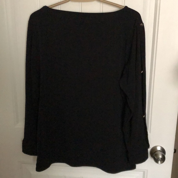 Sweater with open slots down the button sleeves. - Picture 2 of 5